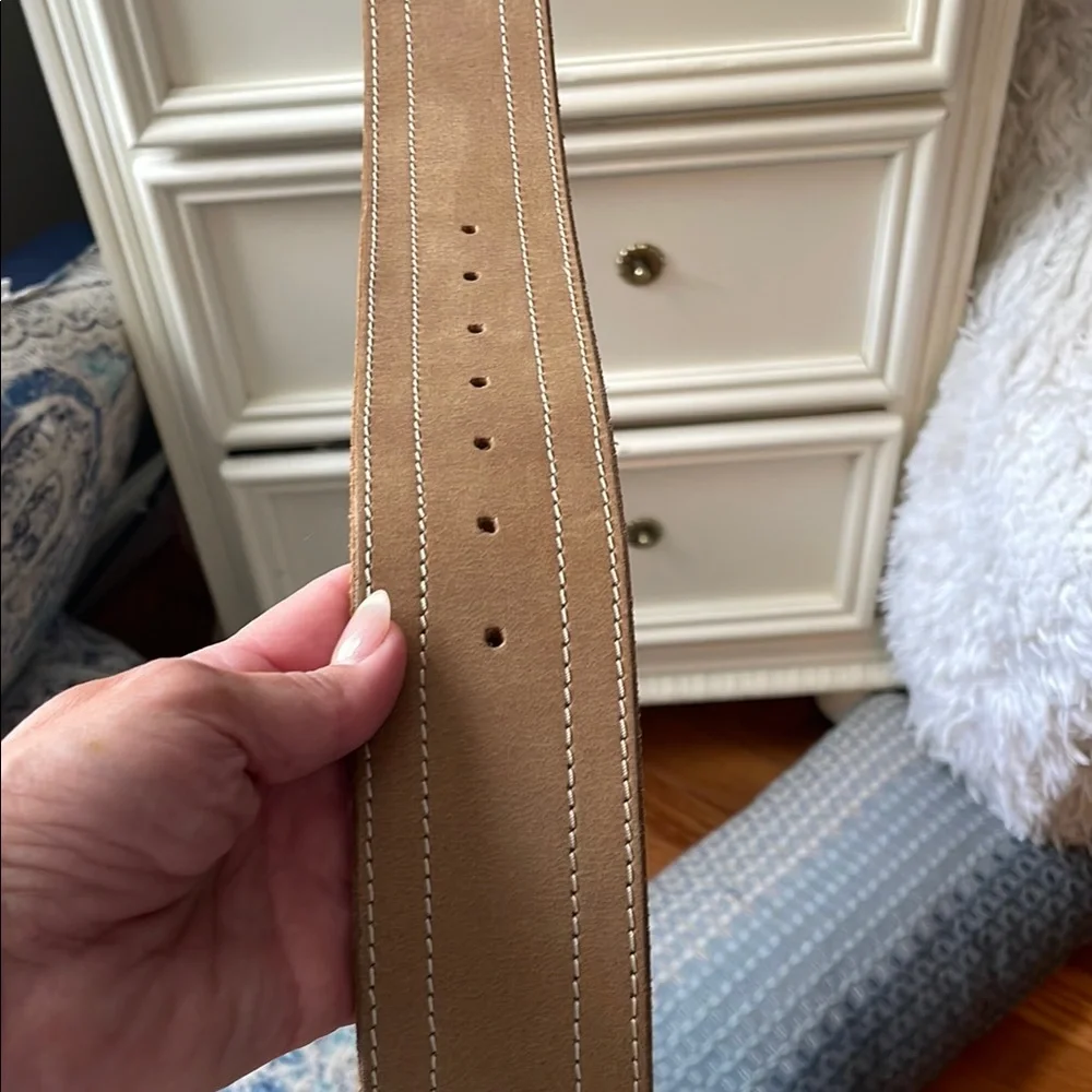 Free People Tan with Silver buckle wide belt. The buckle is unique.